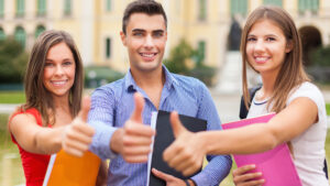 three smiling college students