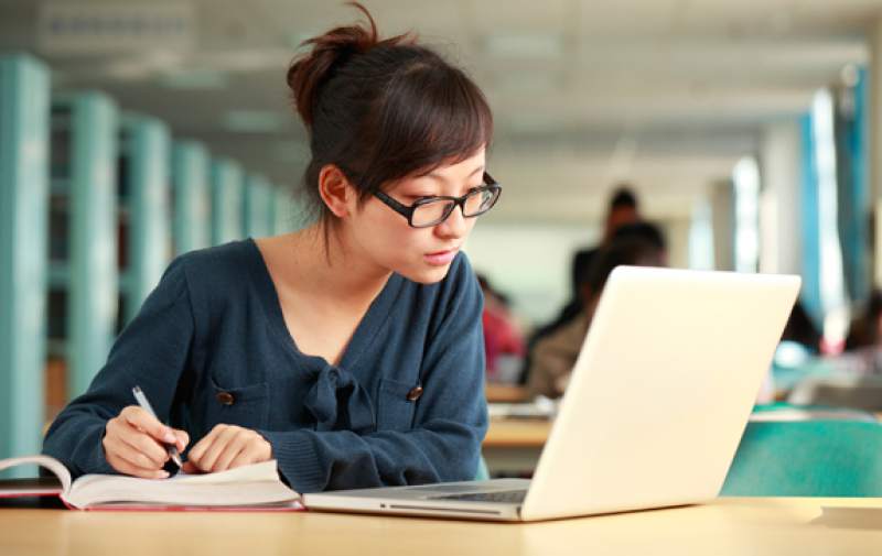 female student taking online course