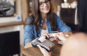 female student using a credit card