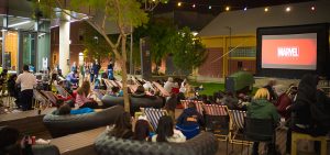 students watching movie on campus