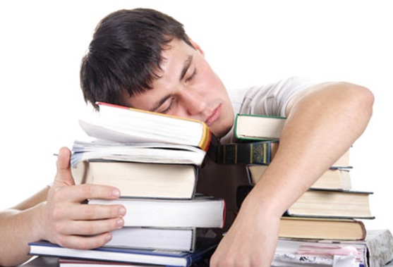 student sleep with books