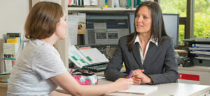 student talking with academic adviser