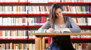 female student studying in library